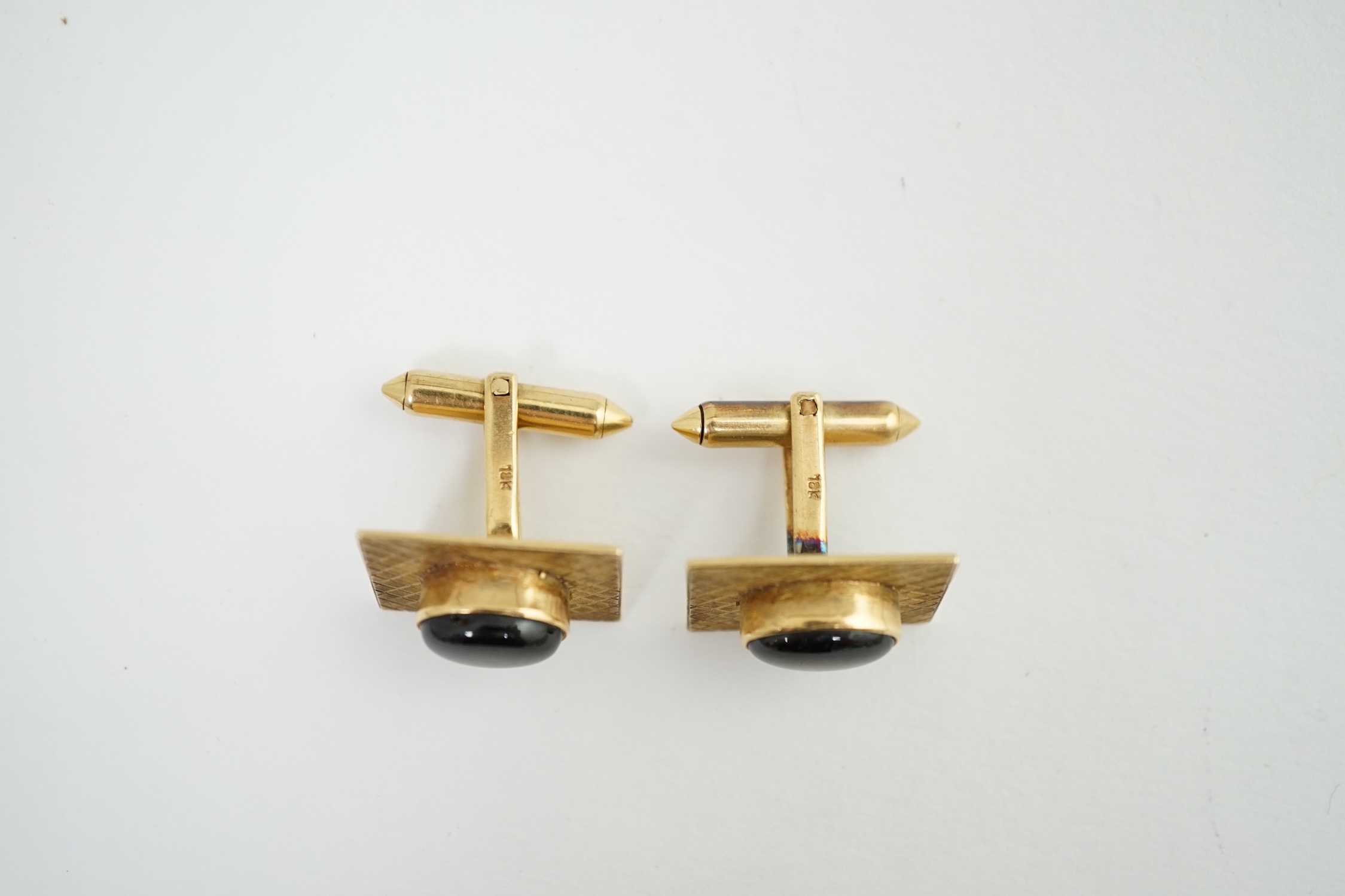 A pair of 18K gold tablet cufflinks, mounted with grey quartz cabochons, in a rubover setting